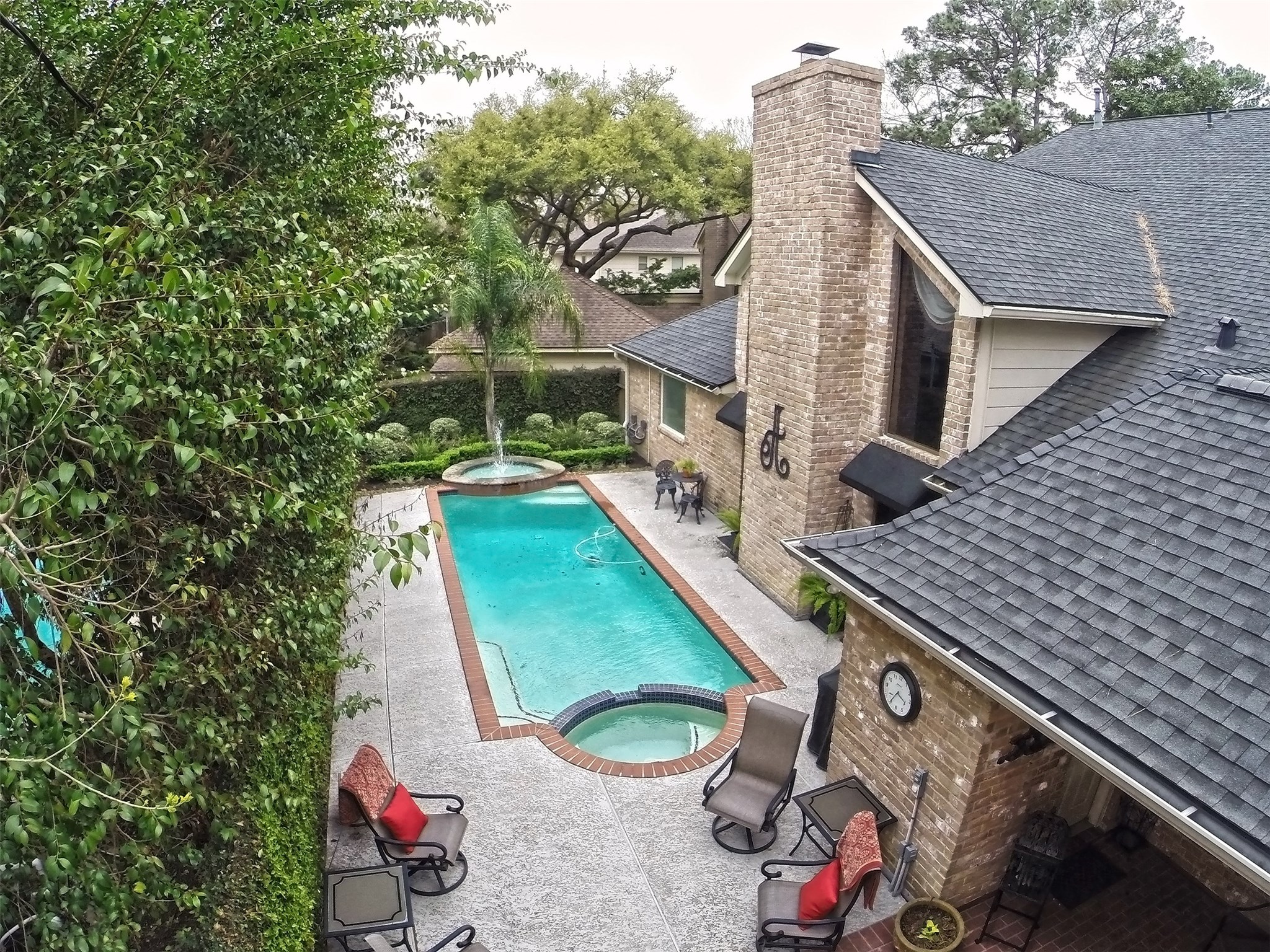 16114 Kempton Park Drive Spring, TX 77379 - Photo 40 of 46 RELAXING BACKYARD RETREAT WITH SPA
AND FOUNTAIN - The backyard is fully surrounded
by beautiful vegetation and soft sounds of the
rustling water fountain. Even on the grayest days
this back yard is beautiful & relaxing with a graceful
palm tree.