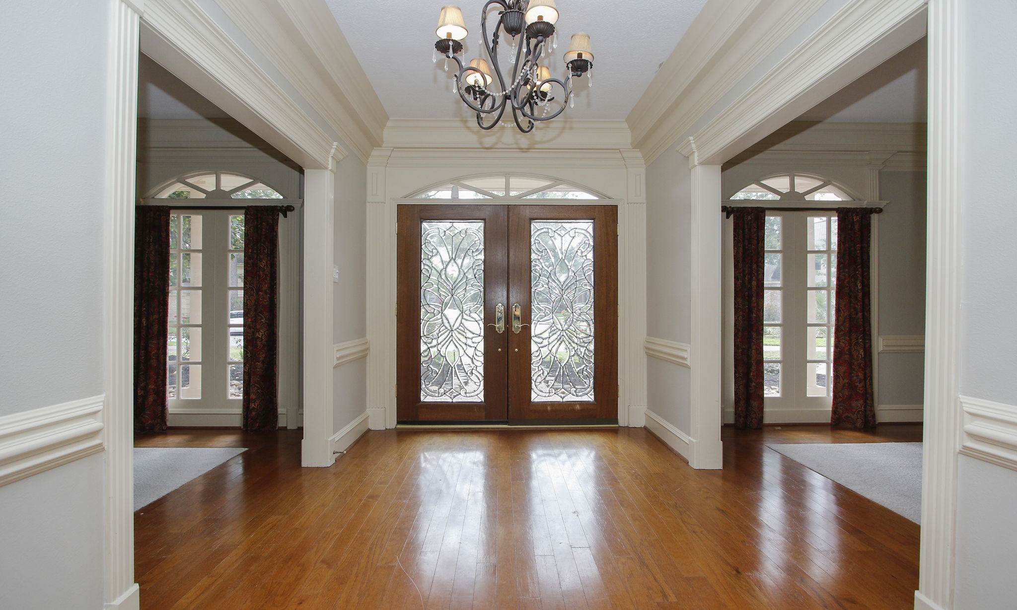 16114 Kempton Park Drive Spring, TX 77379 - Photo 6 of 46 SPARKLING CHANDELIER - The entry has a beautiful crystal chandelier and glowing wood floors.
