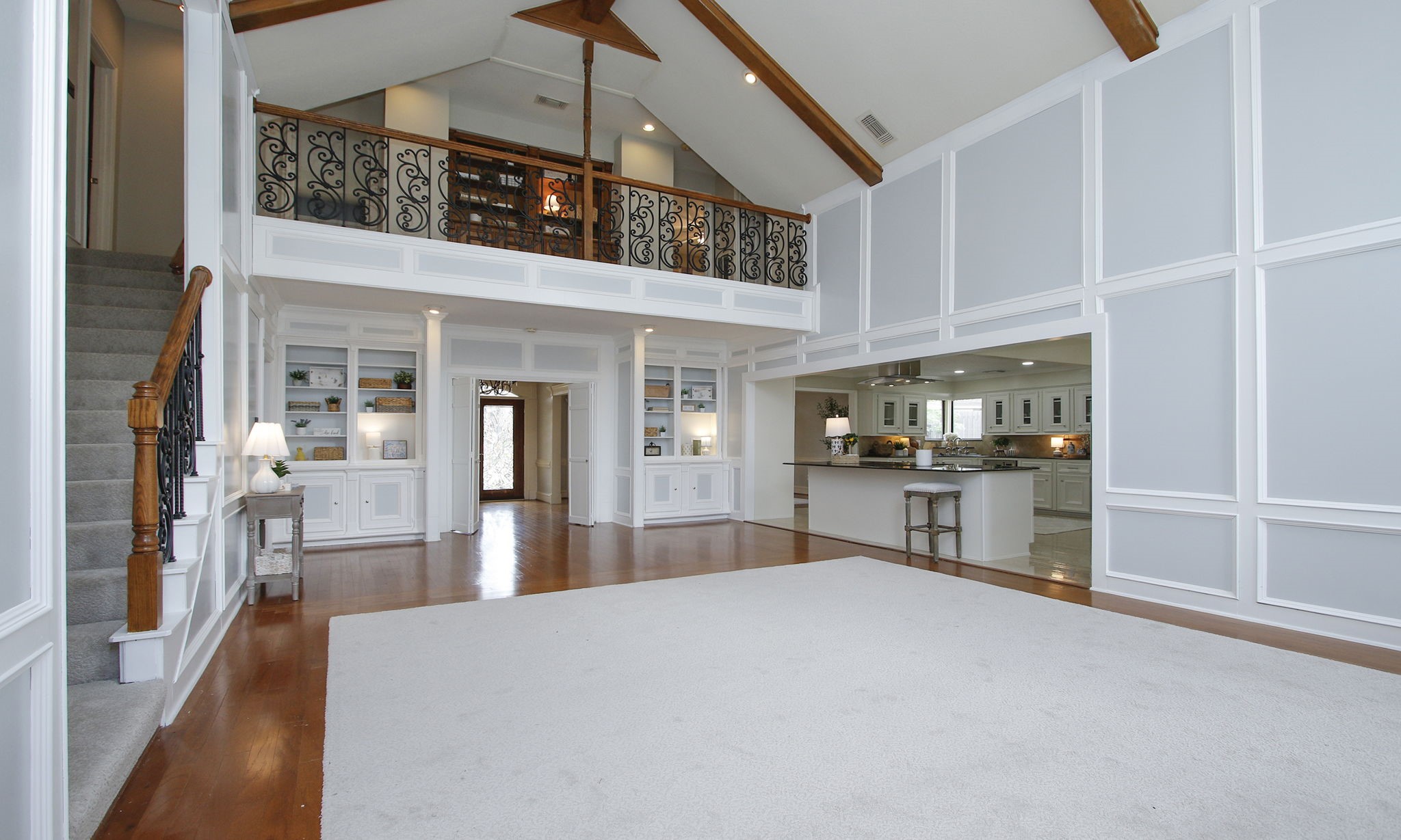 16114 Kempton Park Drive Spring, TX 77379 - Photo 9 of 46 STUNNING SECOND STORY BALCONY - The living area showcases a balcony with wrought iron railing and new carpet.
