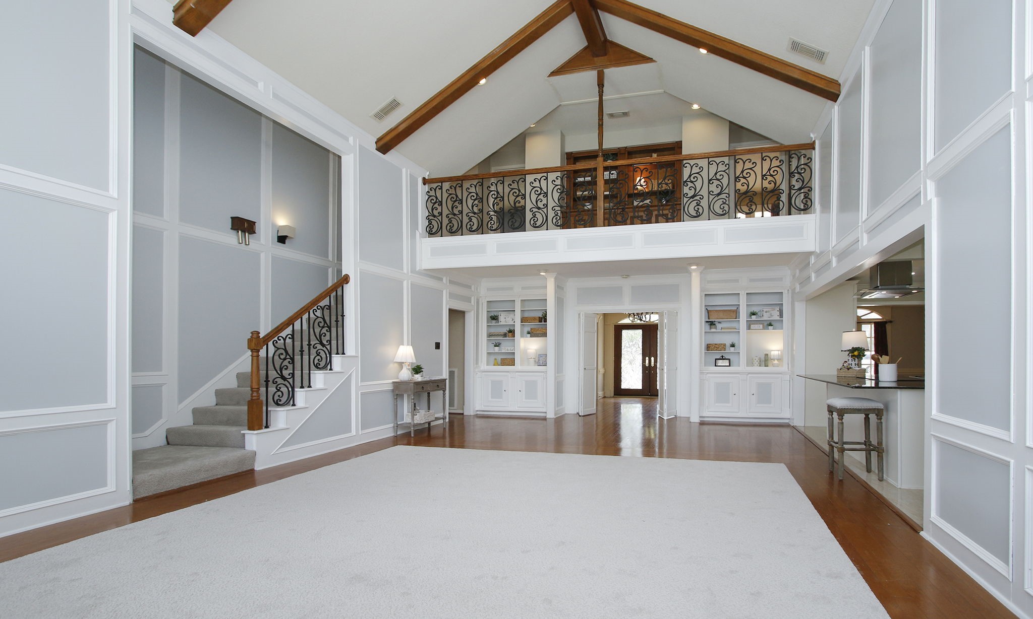 16114 Kempton Park Drive Spring, TX 77379 - Photo 10 of 46 TWO STORY DEN IS OPEN TO THE KITCHEN - The kitchen now features a large island open to the living area.