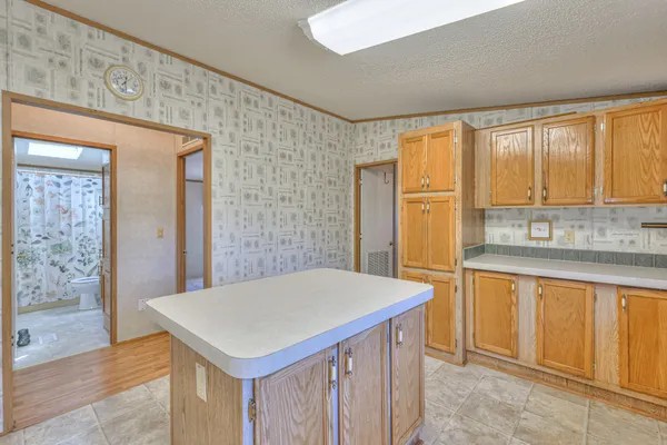 a kitchen with a sink a counter top space and appliances