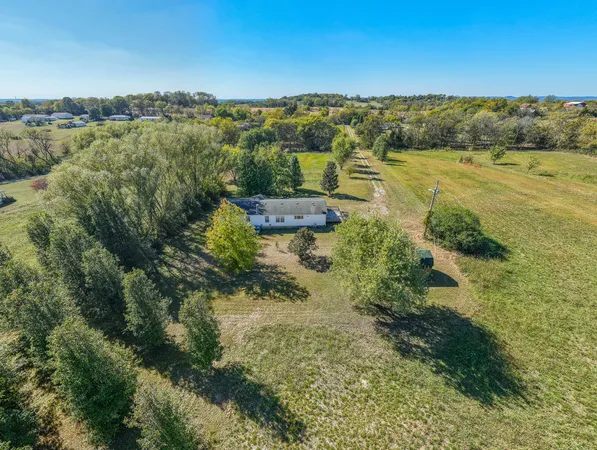 a view of a lake with beach and city view