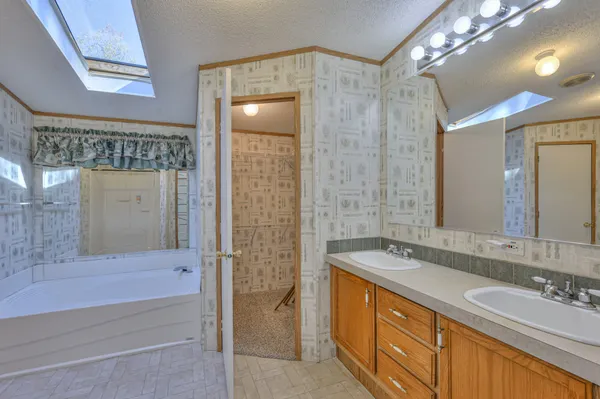 a bathroom with a sink double vanity and a shower