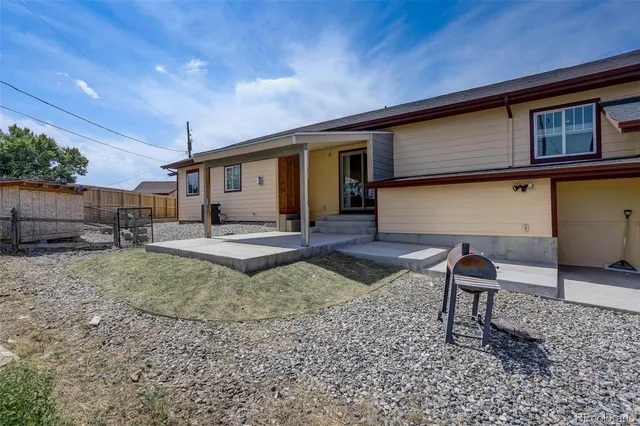 a house view with a backyard space