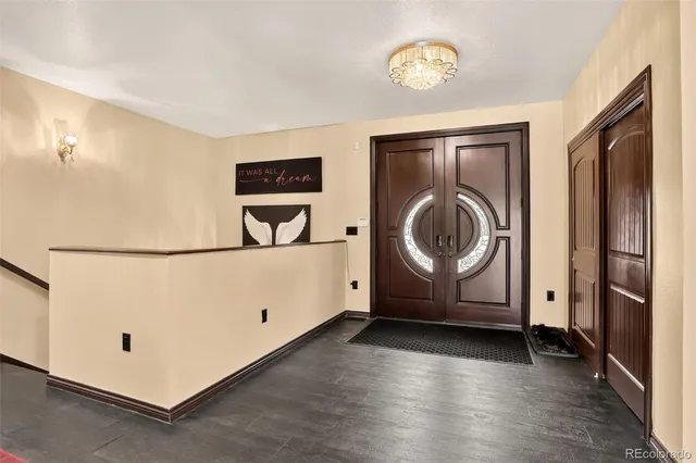 a view of an entryway with wooden floor