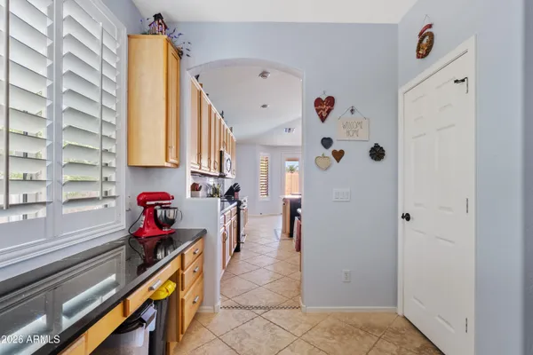 a hallway with a white stove top oven and a refrigerator