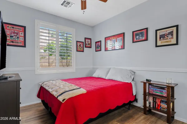 a bedroom with a bed and a book shelf