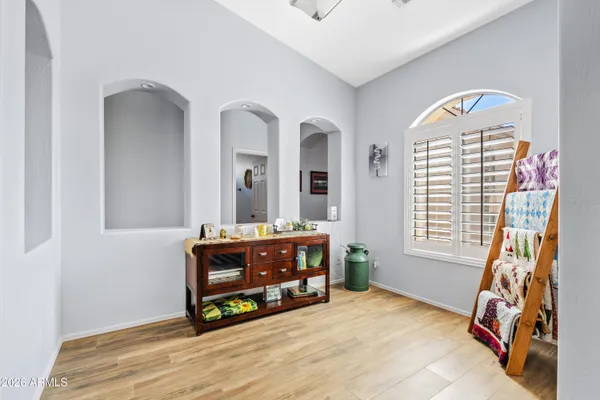 a living room with furniture and a window