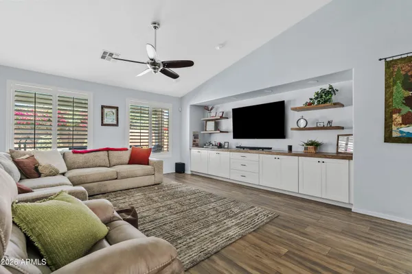 a living room with furniture and a flat screen tv