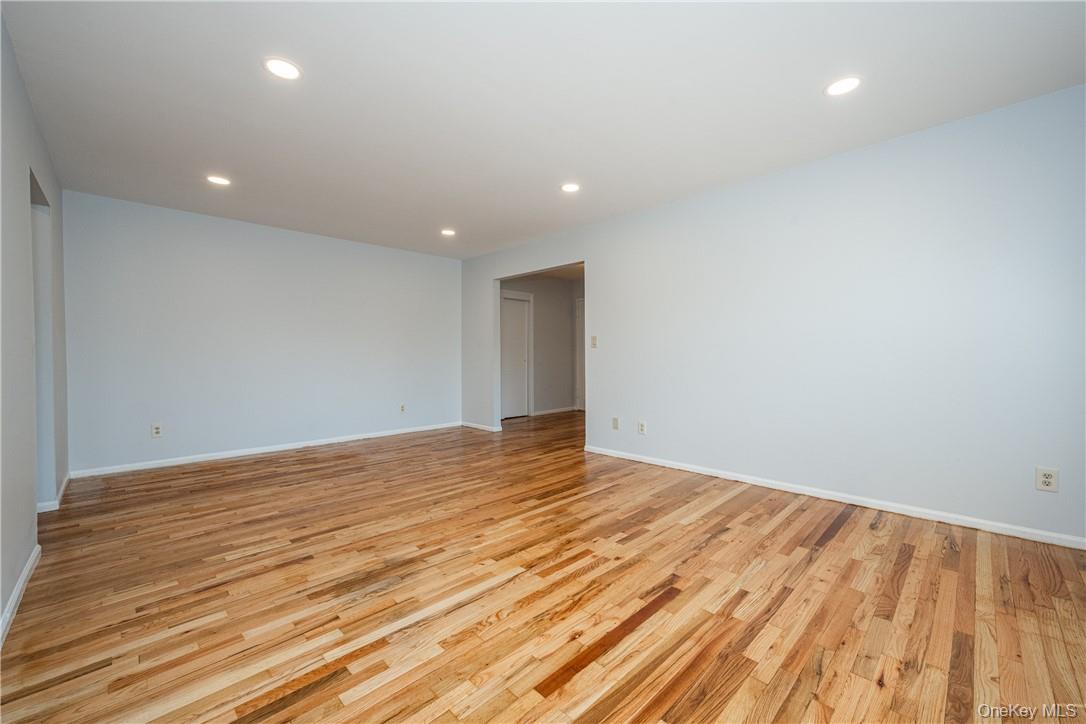 111 Kensington Road, Unit 8 Bronxville, NY 10708 - Photo 5 of 16 a view of empty room with wooden floor