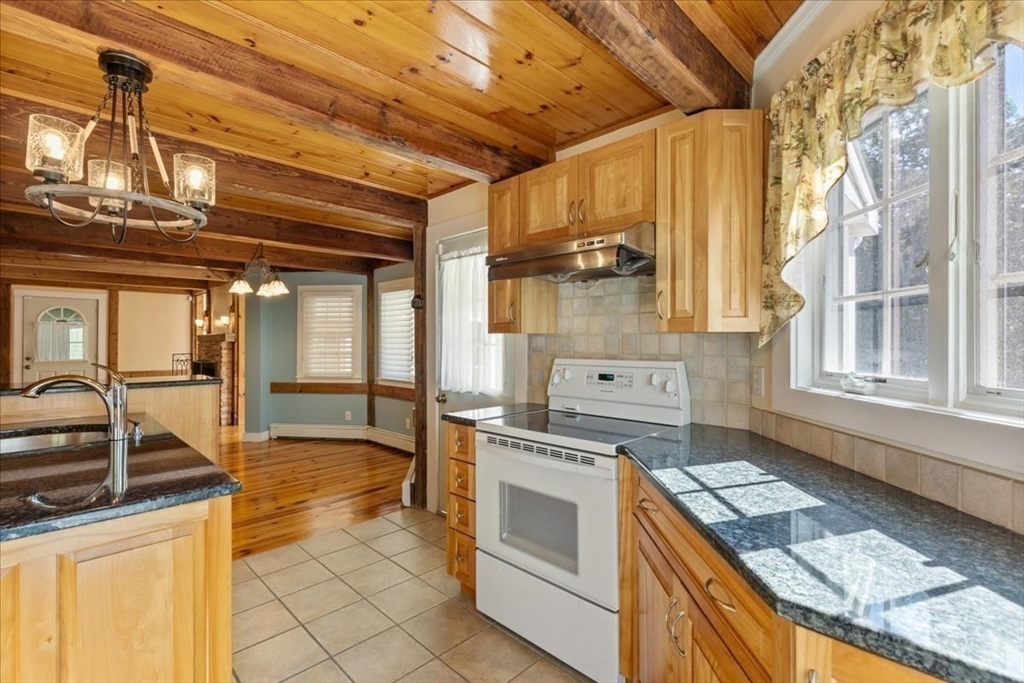 16 Indian Lane Canton, MA 02021 - Photo 13 of 36 a kitchen that has a sink and a stove