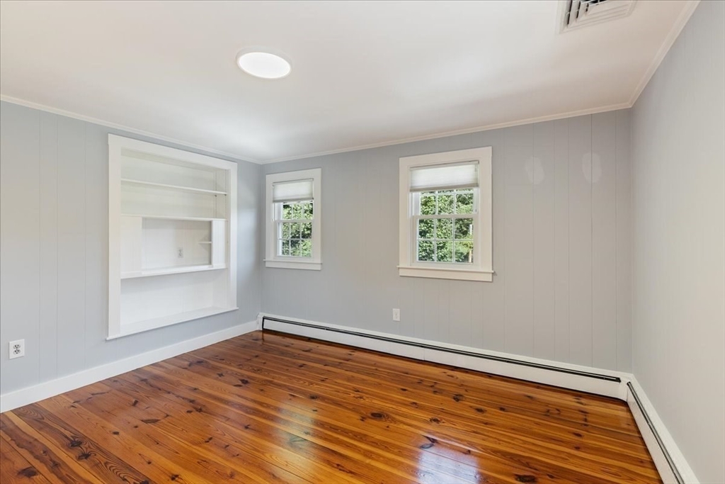 16 Indian Lane Canton, MA 02021 - Photo 23 of 36 wooden floor in an empty room with a window