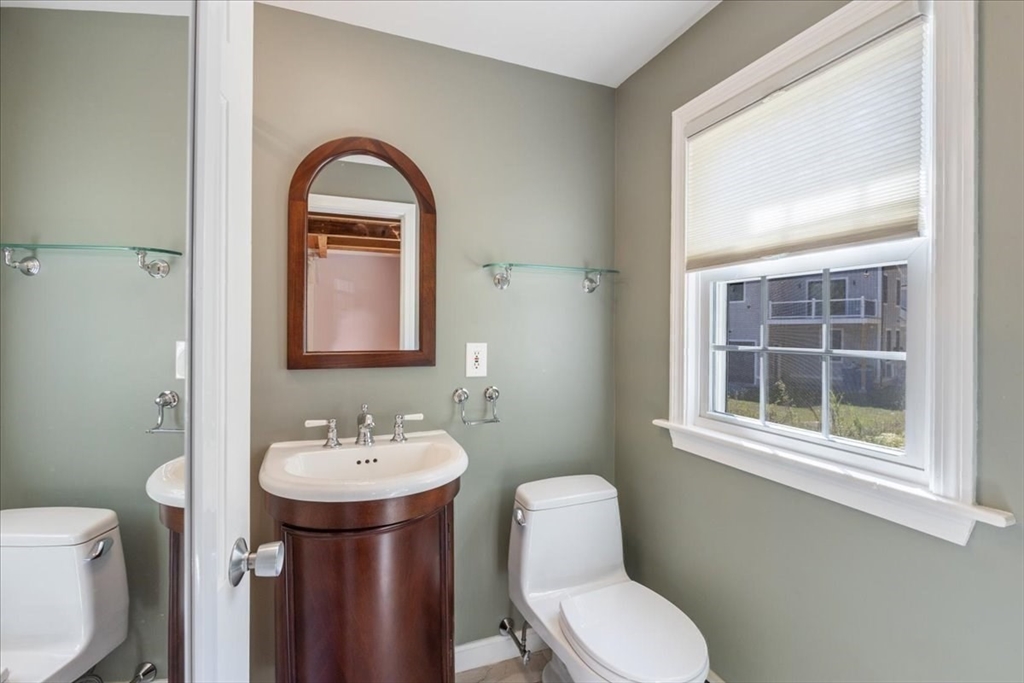 16 Indian Lane Canton, MA 02021 - Photo 24 of 36 a bathroom with a toilet a sink and a window
