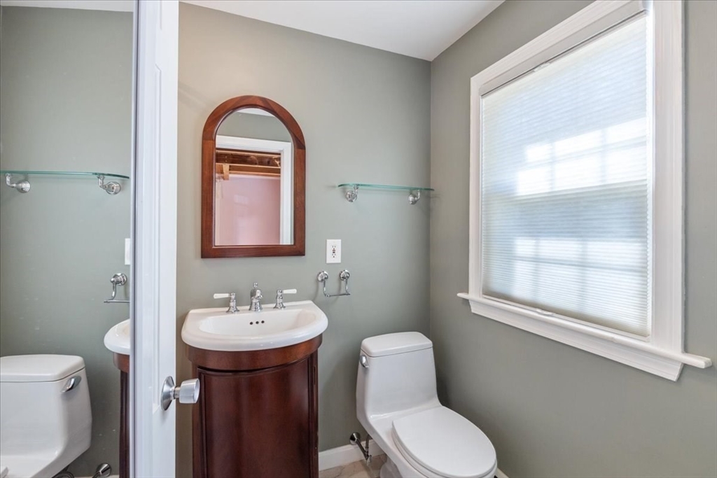 16 Indian Lane Canton, MA 02021 - Photo 25 of 36 a bathroom with a toilet a sink and a window