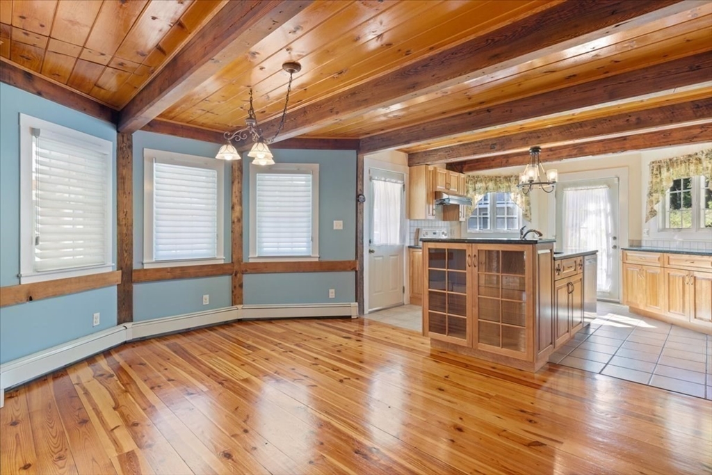 16 Indian Lane Canton, MA 02021 - Photo 8 of 36 a view of empty room with wooden floor and fan