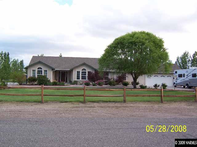5325 Rivers Edge Drive Fallon, NV 89406 - Photo 1 of 9 a front view of house with outdoor space and trees