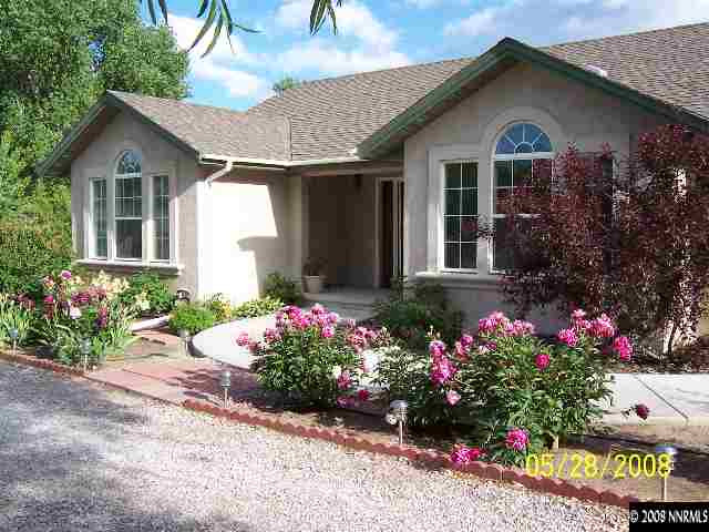 5325 Rivers Edge Drive Fallon, NV 89406 - Photo 2 of 9 a front view of a house with a yard