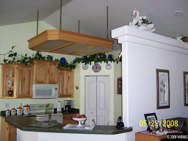 5325 Rivers Edge Drive Fallon, NV 89406 - Photo 3 of 9 a table and chairs in a kitchen