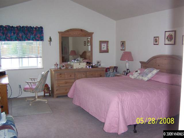 5325 Rivers Edge Drive Fallon, NV 89406 - Photo 6 of 9 a bedroom with a bed and a window