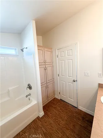 a bathroom with a bathtub and shower