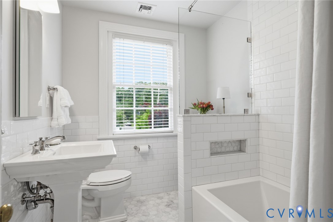 5023 Caledonia Road Richmond, VA 23225 - Photo 32 of 48 A polished secondary bathroom with designer tile a