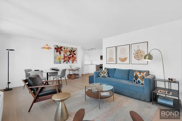 a living room with furniture and a rug