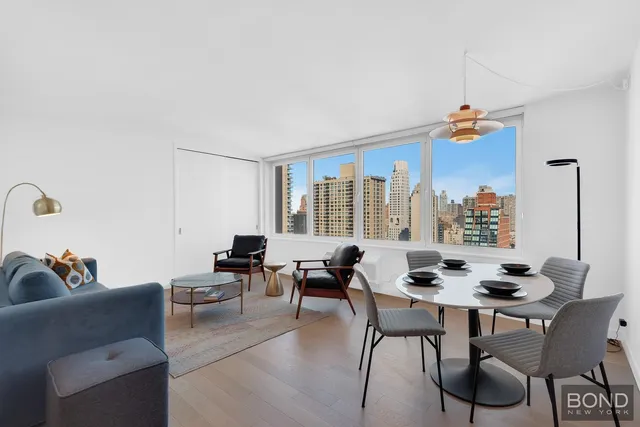 a living room with furniture and a window