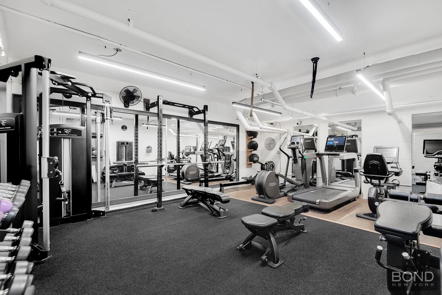 353 East 72nd Street, Unit 26A Manhattan, NY 10021 - Photo 8 of 8 a view of a room with gym equipment