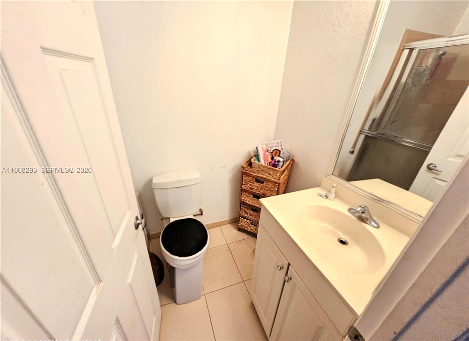 3556 Oleander Terrace, Unit 3556 Riviera Beach, FL 33404 - Photo 12 of 36 a bathroom with a sink and a mirror