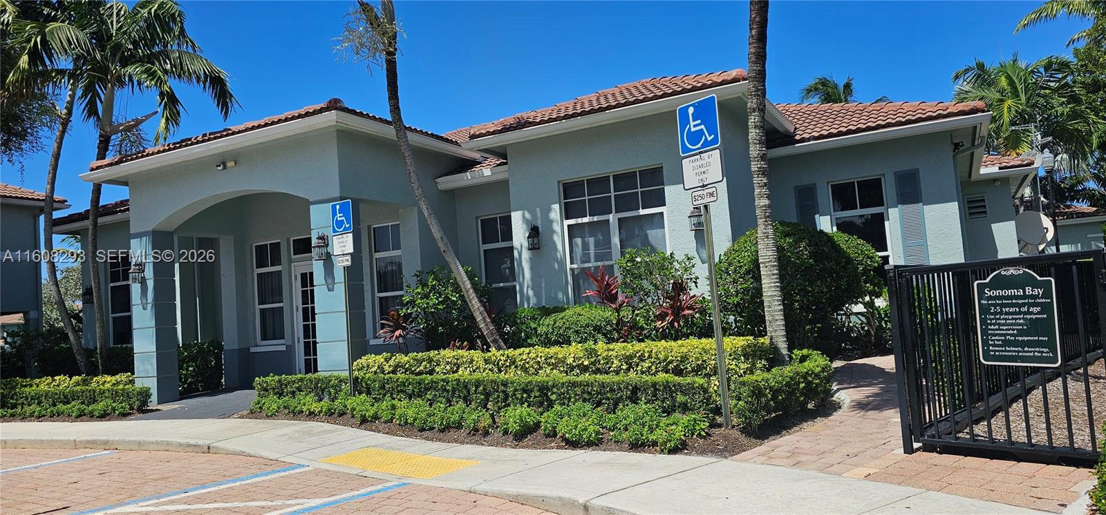 3556 Oleander Terrace, Unit 3556 Riviera Beach, FL 33404 - Photo 18 of 36 a front view of a house with garden