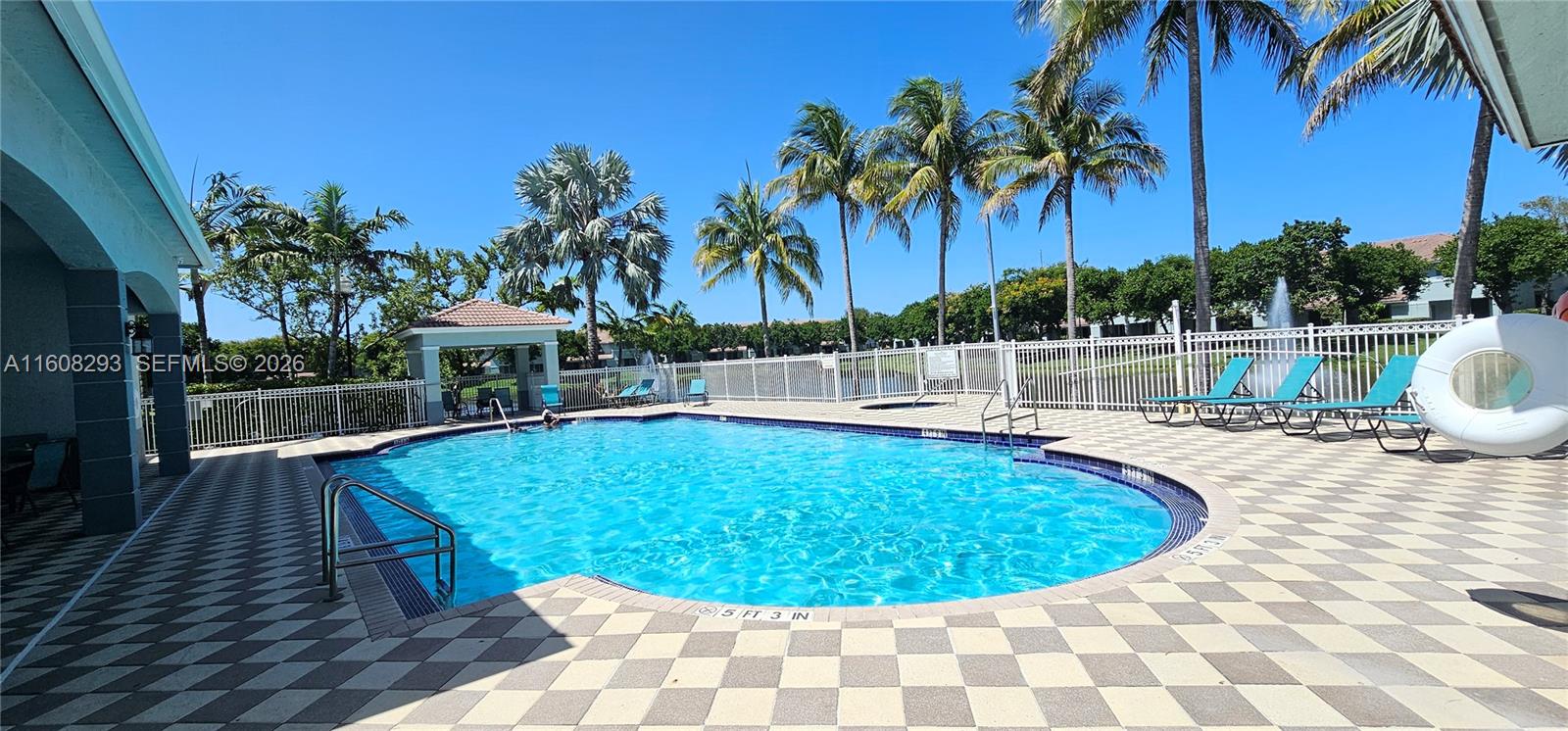 3556 Oleander Terrace, Unit 3556 Riviera Beach, FL 33404 - Photo 21 of 36 a view of a swimming pool with a patio