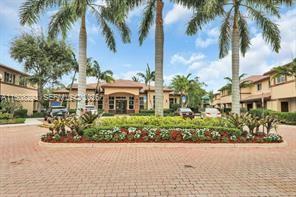 3556 Oleander Terrace, Unit 3556 Riviera Beach, FL 33404 - Photo 28 of 36 a view of a garden with a building