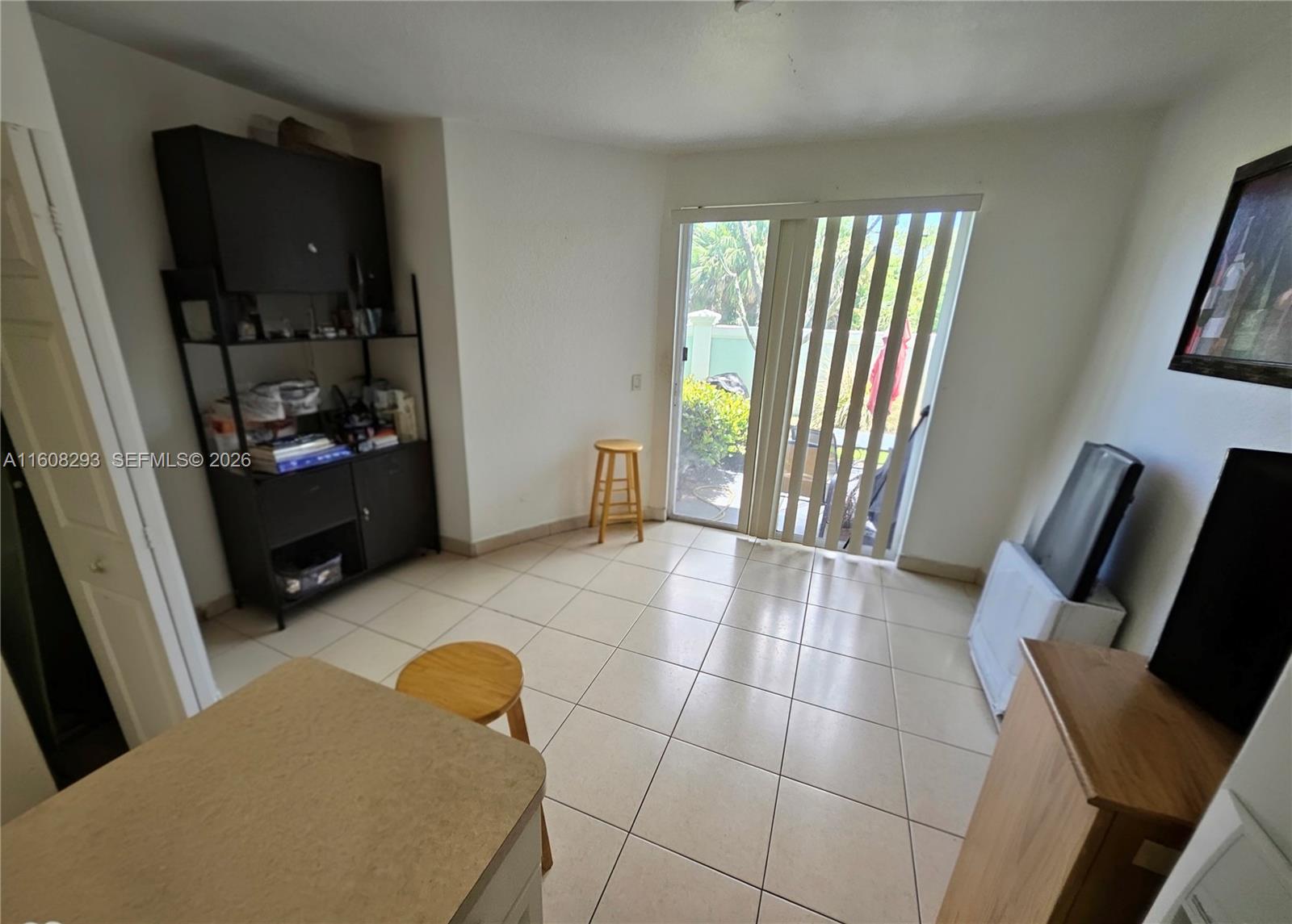 3556 Oleander Terrace, Unit 3556 Riviera Beach, FL 33404 - Photo 6 of 36 a view of a livingroom with furniture and a window
