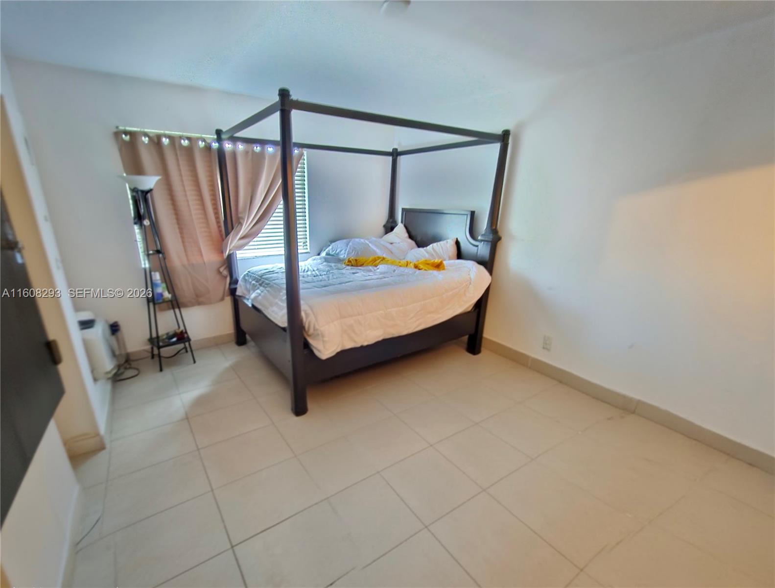 3556 Oleander Terrace, Unit 3556 Riviera Beach, FL 33404 - Photo 10 of 36 a bedroom with a bed and a mirror