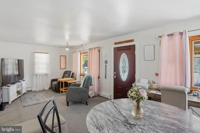 a living room with furniture fireplace and a flat screen tv