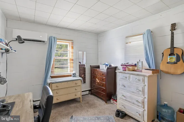a bedroom with a bunk bed and a dresser