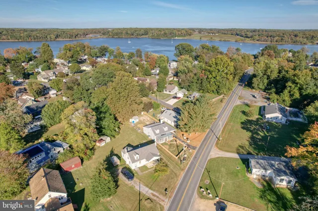 an aerial view of a house with lake view