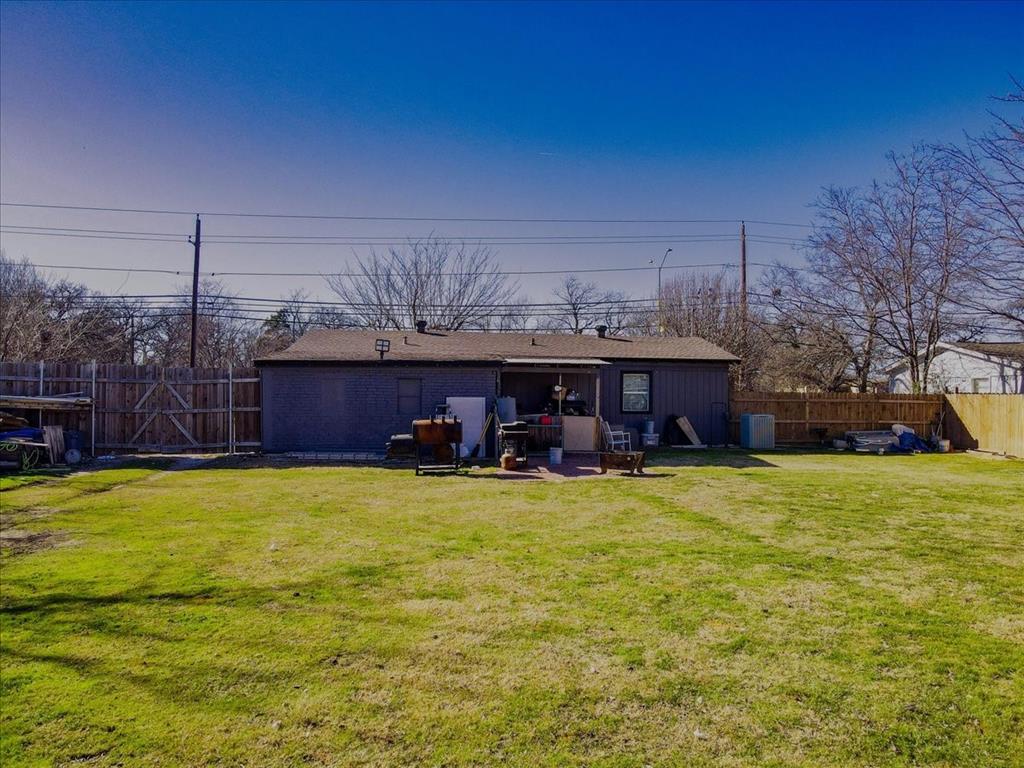 112 North Masters Drive Dallas, TX 75217 - Photo 20 of 22 a view of a swimming pool with a yard