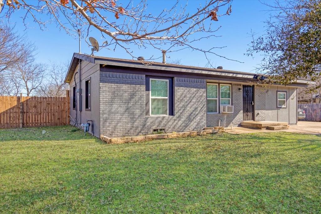 112 North Masters Drive Dallas, TX 75217 - Photo 2 of 22 a front view of a house with a yard