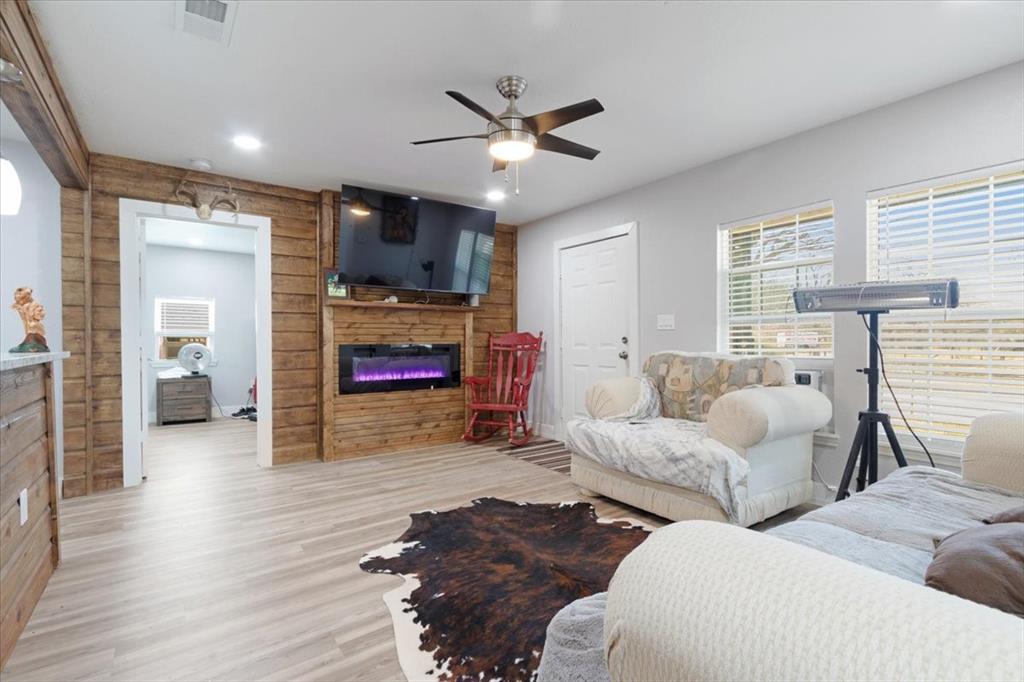 112 North Masters Drive Dallas, TX 75217 - Photo 8 of 22 a living room with furniture and a wooden floor