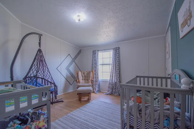 a bedroom with furniture and a window