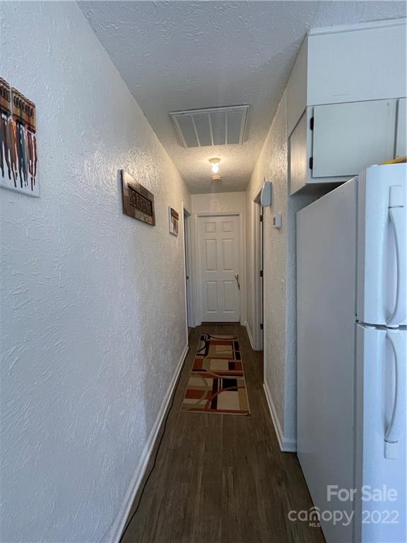7400 R R H Road Hickory, NC 28602 - Photo 12 of 30 a view of a hallway with a kitchen