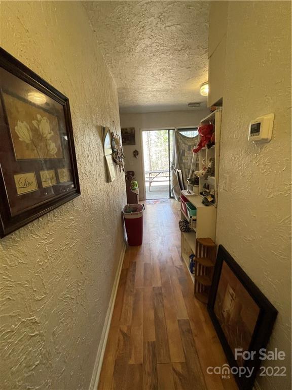 7400 R R H Road Hickory, NC 28602 - Photo 13 of 30 a view of a living room with furniture and a flat screen tv