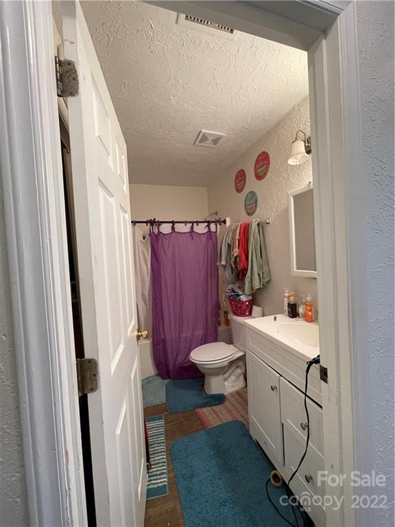 7400 R R H Road Hickory, NC 28602 - Photo 14 of 30 a bathroom with a sink toilet and shower