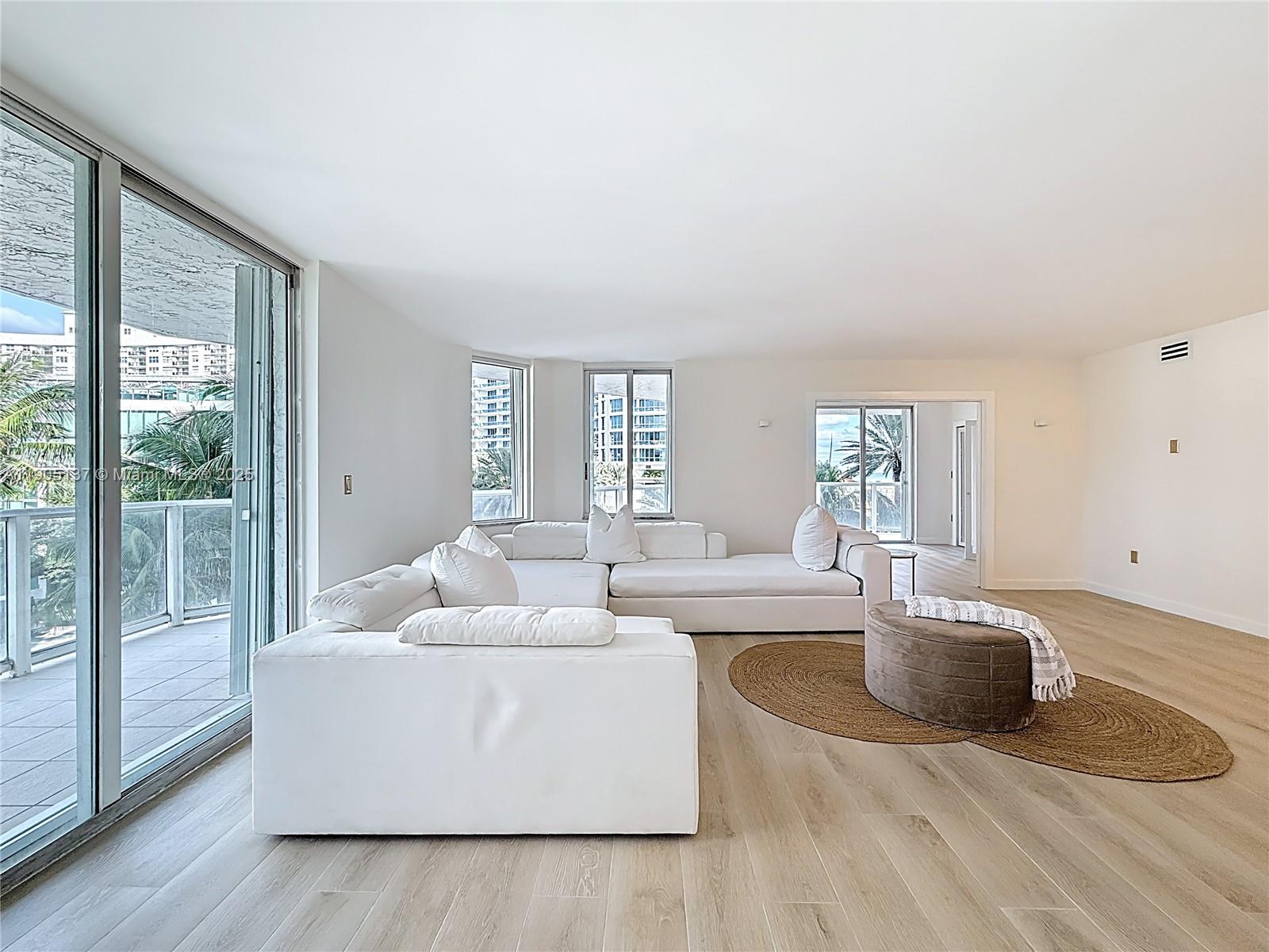 5900 Collins Avenue, Unit 508 Miami Beach, FL 33140 - Photo 5 of 39 a living room with furniture and a potted plant