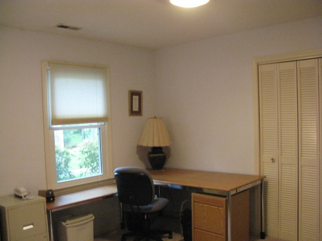 4201 Webster Court Raleigh, NC 27609 - Photo 17 of 25 Another view of 4th bedroom currently being used as a home office. This room adjoins the 5th bedroom and is directly off the front entry. The in-law suite can be closed off for privacy and still allow access to the 25 x17 Great Room. Bedroom # 4