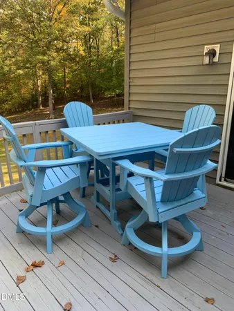 a view of an outside dining space with furniture