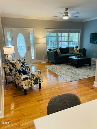 a living room with large furniture and a large window