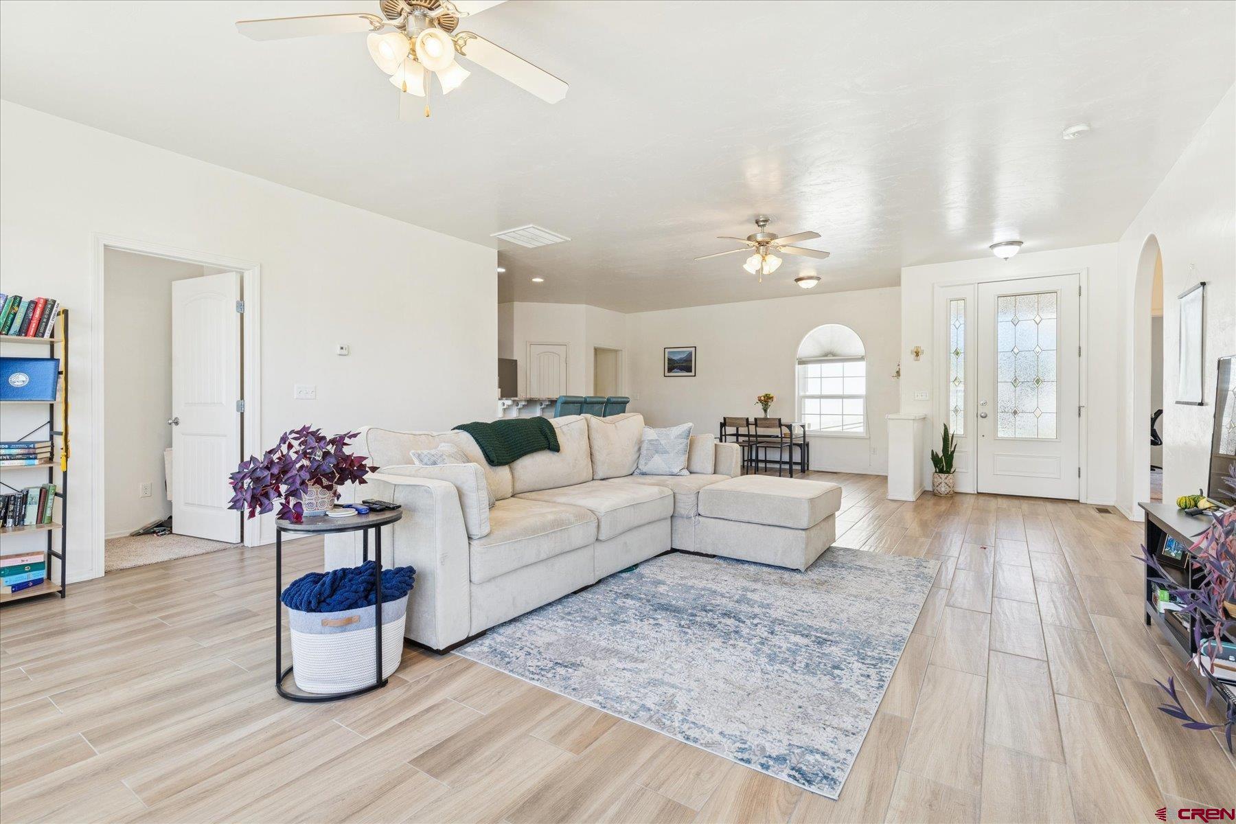 721 Arbor Street Cortez, CO 81321 - Photo 4 of 16 a living room with furniture and wooden floor
