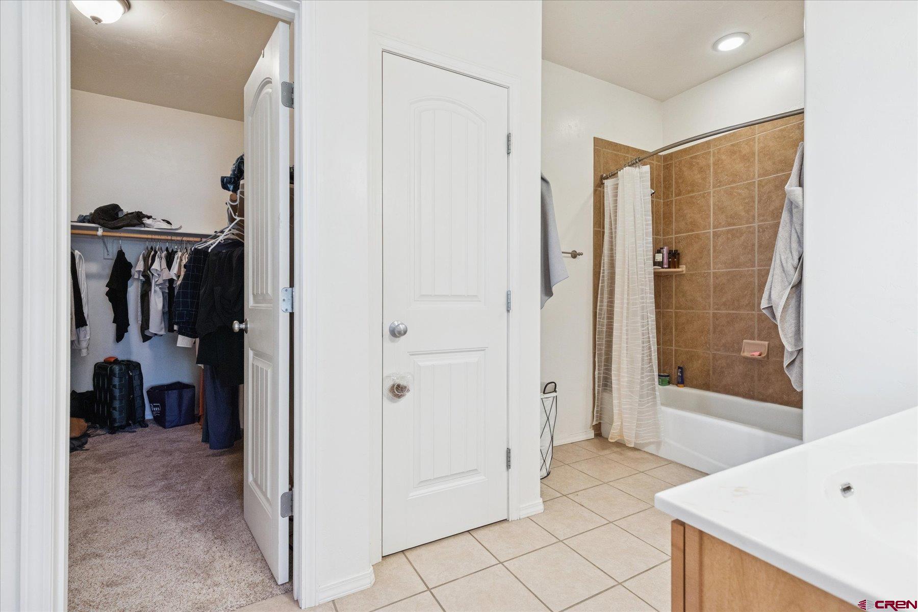 721 Arbor Street Cortez, CO 81321 - Photo 6 of 16 a view of a bathroom with a shower and a sink